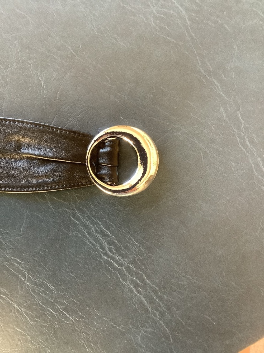Black leather belt with silver bucackle.